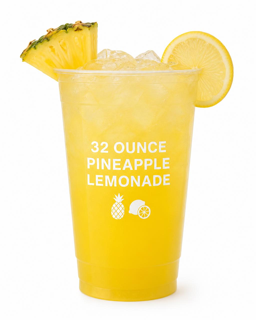 32 ounce clear cup of pineapple lemonade with a pineapple wedge garnish